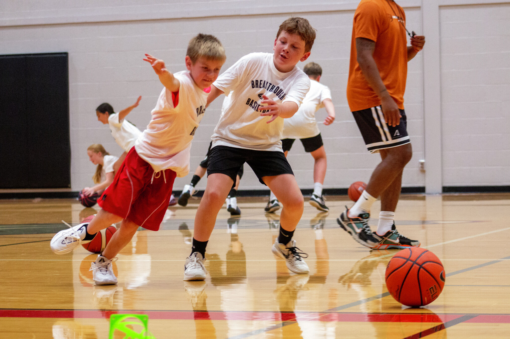 Pro basketball player Nick Neal pushes campers through heat at Reed City camp