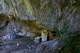 A visitor approaches a chapel at the Holy Cave of St. Dionysios in the Enipeas Gorge on Mount Olympus in northern Greece, Tuesday, July 14, 2026.