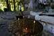 Candles burn outside a chapel at the Holy Cave of St. Dionysios in the Enipeas Gorge on Mount Olympus in northern Greece, Tuesday, July 14, 2026.