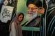 A woman walks past a mural depicting a portrait of the late Iranian Supreme Leader Ayatollah Ali Khamenei, who was killed in the U.S. and Israel strike on Feb. 28, in downtown Tehran, Iran, Saturday, July 18, 2026.