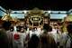 Festival participants carry Yasaka Shrine's Eastern Mikoshi back into the shrine's main hall following the "Mikoshi Arai" purification ritual ahead of the Gion Matsuri festival in Kyoto, western Japan, Friday, July 10, 2026.