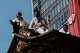 Festivalgoers are seen atop a festival float during one of the main parades of Shinto's Gion Matsuri festival in Kyoto, western Japan, Friday, July 17, 2026.