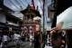 A festival float passes through a narrow street during one of the main parades of Shinto's Gion Matsuri festival in Kyoto, western Japan, Friday, July 17, 2026.