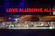 A sign reading “Love All Serve All” above the kitchen at the Hard Rock Cafe in Los Angeles.