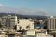 La fumée du Little Fire s'élève derrière les collines d'East Bay, vue du centre-ville d'Oakland, le mardi 21 juillet 2026. Les incendies dans les régions de Pleasanton et Sunol ont déclenché des ordres et des avertissements d'évacuation.