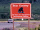 FILE: A road sign warning of dangerous grizzly bears alongside the highway near Glacier National Park, Mont.