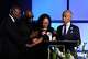 Christine Wonsley, center, is flanked by her husband Elmore, second from left, attorney Ben Crump, left, and Rev, Al Sharpton, right, during a memorial service for her son Nolan Xavier Wells, an 18-year-old found dead after taking a July 4 boat trip with friends, Monday, July 20, 2026, in Ocean Springs, Miss.