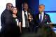 Attorney Ben Crump, center, speaks next to Elmore and Christine Wonsley, at left, and Rev. Al Sharpton during a memorial service for Nolan Xavier Wells, an 18-year-old found dead after taking a July 4 boat trip with friends, Monday, July 20, 2026, in Ocean Springs, Miss.