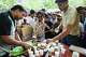 Volunteers distribute beverages received from supporters to protestors during a demonstration demanding educational reforms as part of the Cockroach Janta Party's ongoing protest movement in New Delhi, India, Thursday, July 23, 2026.