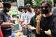 Volunteers distribute food received from supporters to protestors during a demonstration demanding educational reforms as part of the Cockroach Janta Party's ongoing protest movement in New Delhi, India, Thursday, July 23, 2026.