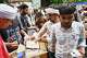 Volunteers distribute food received from supporters to protestors during a demonstration demanding educational reforms as part of the Cockroach Janta Party's ongoing protest movement in New Delhi, India, Thursday, July 23, 2026.