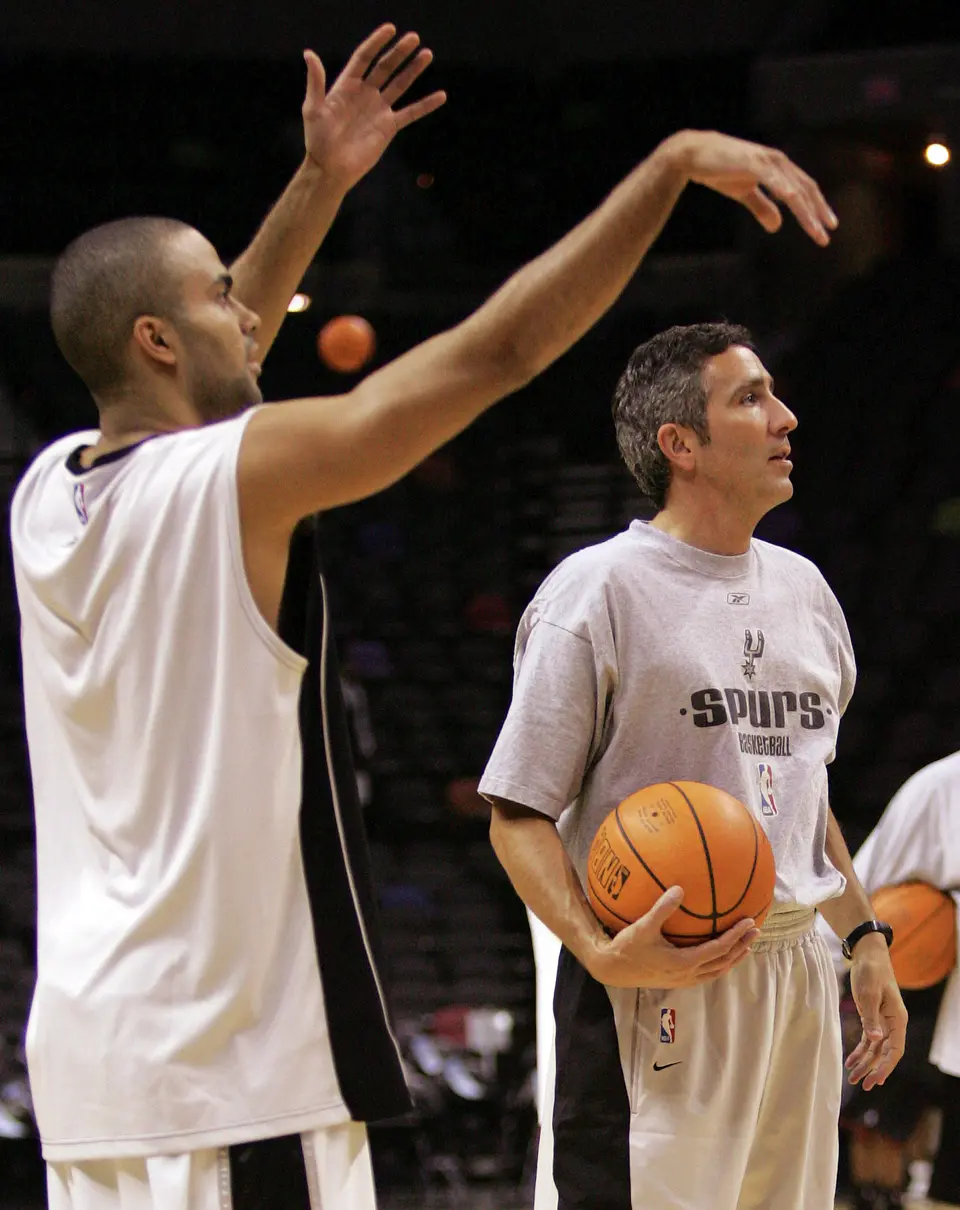 SPORTS - FOR LUDDEN SUNDAY STORY - Spurs shooting coach Chip Engelland (right) works with guard Tony Parker prior to their pre-season game against the Philadelphia 76ers at the SBC Center on Thursday, October 27, 2005. (Kin Man Hui/staff)
