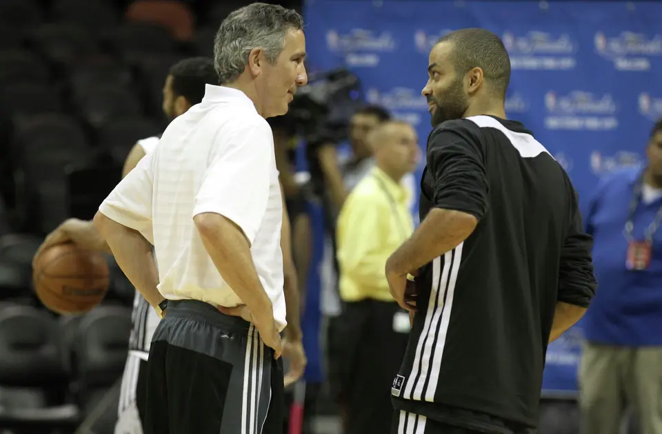 Spurs assistant coach Chip Engelland (left) and point guard Tony Parker chat during the NBA Finals practice and media session at the AT&T Center on Wednesday, June 4, 2014. The Spurs will play Game 1 of the Finals against the Miami Heat on Thursday. (Kin Man Hui/San Antonio Express-News)
