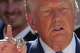 President Donald Trump holds a championship ring during an event to honor the 2025 World Series champions Los Angeles Dodgers in the Rose Garden of the White House, Thursday, July 23, 2026, in Washington.