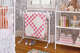 Weston Table’s iron blanket holder, with rabbit finial details, offers a sweet way to display quilts in a nursery.