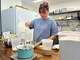 Pastry chef Amanda Tabadero pours milk into a plastic container while preparing ingredients for maritozzi at Creature Coffeeshop in Kaneʻohe, Hawaii, Tuesday, July 7, 2026. (Hikari Mae Hida/Honolulu Civil Beat via AP)