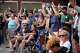 Attendees gesture as they gather at a memorial Thursday, July 23, 2026, in Madison, Wis., where a Madison police officer shot and killed Corey Durell Ruiz on Wednesday.
