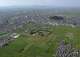 This shows Fujiwara Palace Ruins, foreground, with Mr. Miminashi, background, in Kashihara, Nara prefecture, western Japan, on Sept. 9, 2024. (Kyodo News via AP)