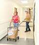 Army veteran Karess Branch pushes a cart filled with groceries as David Daniels follows and Soldiers’ Angels volunteer Bart Alvara looks on Thursday, July 23, 2026, at the nonprofit’s new food pantry in Dallas.