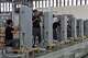 FILE - Workers assemble charging stations at the Mengma Intelligent Transportation Equipment Manufacturing Base in Hohot in northern China's Inner Mongolia province on Thursday, June 11, 2026.