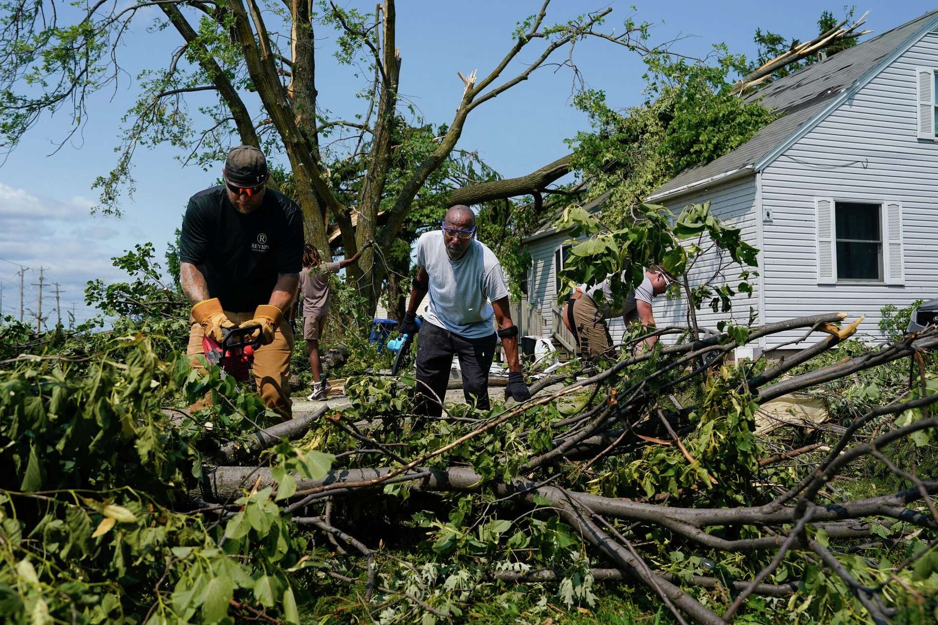 Twisted trees, crushed cars and shattered homes in Wisconsin, in photos