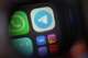 The app Telegram, center, a popular messenger app in Russia restricted by authorities, is shown on a smartphone in Moscow, Russia, Wednesday, July 29, 2026.