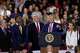 Republican Senate candidate Mike Rogers speaks as Rep. Tim Walberg, R-Mich., Rep. John James, R-Mich., President Donald Trump and Rep. Lisa McClain, R-Mich., listen at an event at the General Motors Proving Ground Monday, July 27, 2026, in Milford, Mich.