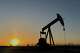 FILE - The sun sets as a pump jack operates near Loving, N.M., on Tuesday, May 20, 2025.