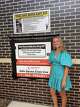 Sarah McDermott stands next to Dallas County's first Safe Haven Baby Box at Rowlett Fire Station No. 1 McDermott, who helped to bring the box to the city through community fundraising.