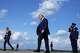 President Donald Trump, center, walks from Air Force One at Morristown Municipal Airport in Morristown, N.J., Friday, July 31, 2026, from Camp David, the presidential retreat.
