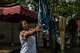 Esther Lutula, a 26 year-old woman who is four months pregnant and a mother of four who stopped going for prenatal checkups shortly after the current Ebola outbreak, does the laundry outside her house in Bunia, northeastern, Congo, Tuesday, June 16, 2026.