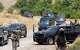 FILE - Forces of the regional Kurdish administration secure the area of the Jasana Cave ahead of a symbolic disarmament ceremony by the separatist PKK group as part of the peace process with Turkey, in Sulaymaniyah governorate, Iraq, Friday, July 11, 2025.