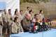 FILE - Kurdistan Workers' Party (PKK) fighters, who reportedly withdrew from Turkey with their weapons, stand to attention during a ceremony in the Qandil area of northern, Iraq, Sunday, Oct 26, 2025.
