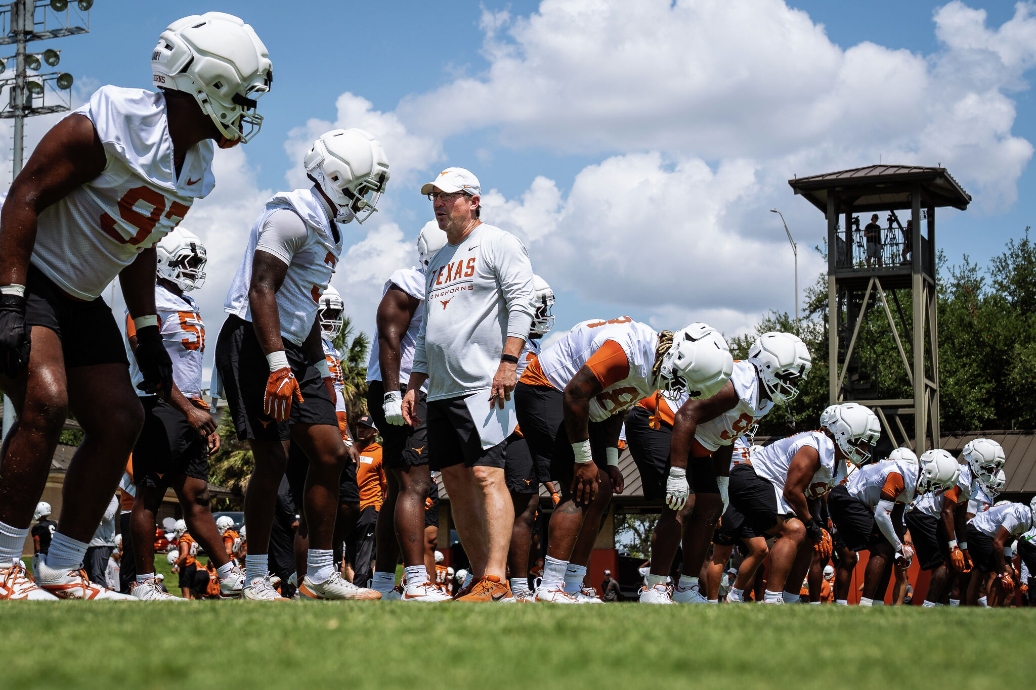 Will Muschamp conducting intense defensive drills with Texas football players during practice