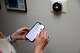 Debbie Mansfield uses an app to control the temperature in her San Francisco home in August 2024. Mansfield cut her family’s PG&E bill by more than a third after working with energy consultant James Tuleya.