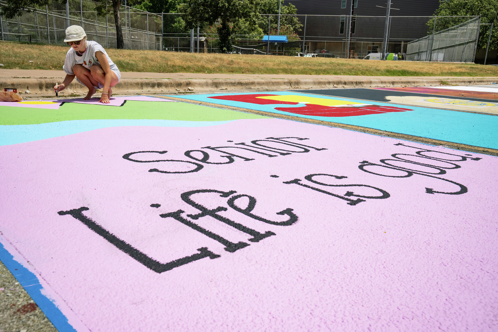 Check out senior parking spots painted in back-to-school tradition at Austin High