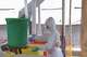 A health worker in protective gear washes her hands at the treatment centre in Bunia General Hospital in Ituri, eastern Congo, Tuesday, Aug. 11, 2026.