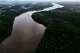 FILE - Trees line the Oiapoque River on the border between Brazil and French Guiana, in Oiapoque, Amapa state, Brazil, March 10, 2026.