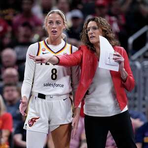 Fever All-Stars Aliyah Boston and Kelsey Mitchell in game action defending coach