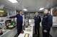 Russian President Vladimir Putin, center, listens to a navy officer as he visits the Varyag missile cruiser of the Pacific Fleet to watch a military exercise near Yuzhno-Sakhalinsk, on Sakhalin Island, Russia, Wednesday, Aug. 12, 2026, as Admiral Viktor Liina, right, looks on. (Gavriil Grigorov, Sputnik, Kremlin Pool Photo via AP)
