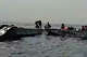 In this image taken from a video people are rescued from an overloaded ferry that capsized on Zimbabwe's Lake Kariba on Tuesday, Aug. 11, 2026. (Maxton Kanhema via AP)