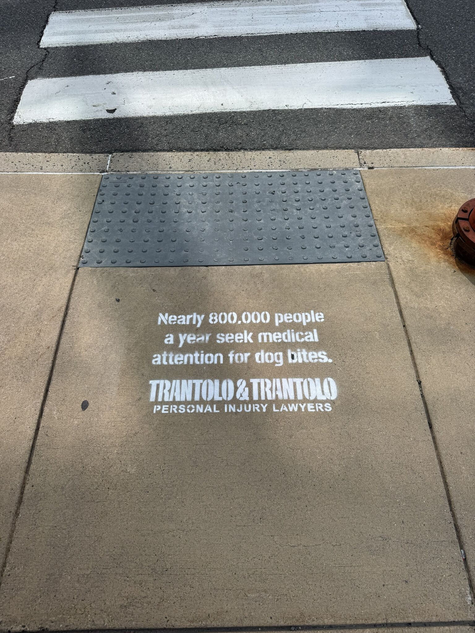 Law firm removes sidewalk ads after Hartford mayor threatens fine