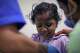 An injured child receives treatment at a hospital after a strike on the port of Mokha, Yemen, Friday, Aug. 14, 2026.