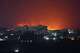 Flames and smoke rise from the port of Mokha during a strike in Yemen, Friday, Aug. 14, 2026.