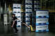 FILE: A worker moves empty boxes of battery cells at the battery manufacturing plant at PT HLI Green Power, Indonesia’s first electric vehicle battery cell manufacturer, in Karawang, West Java.