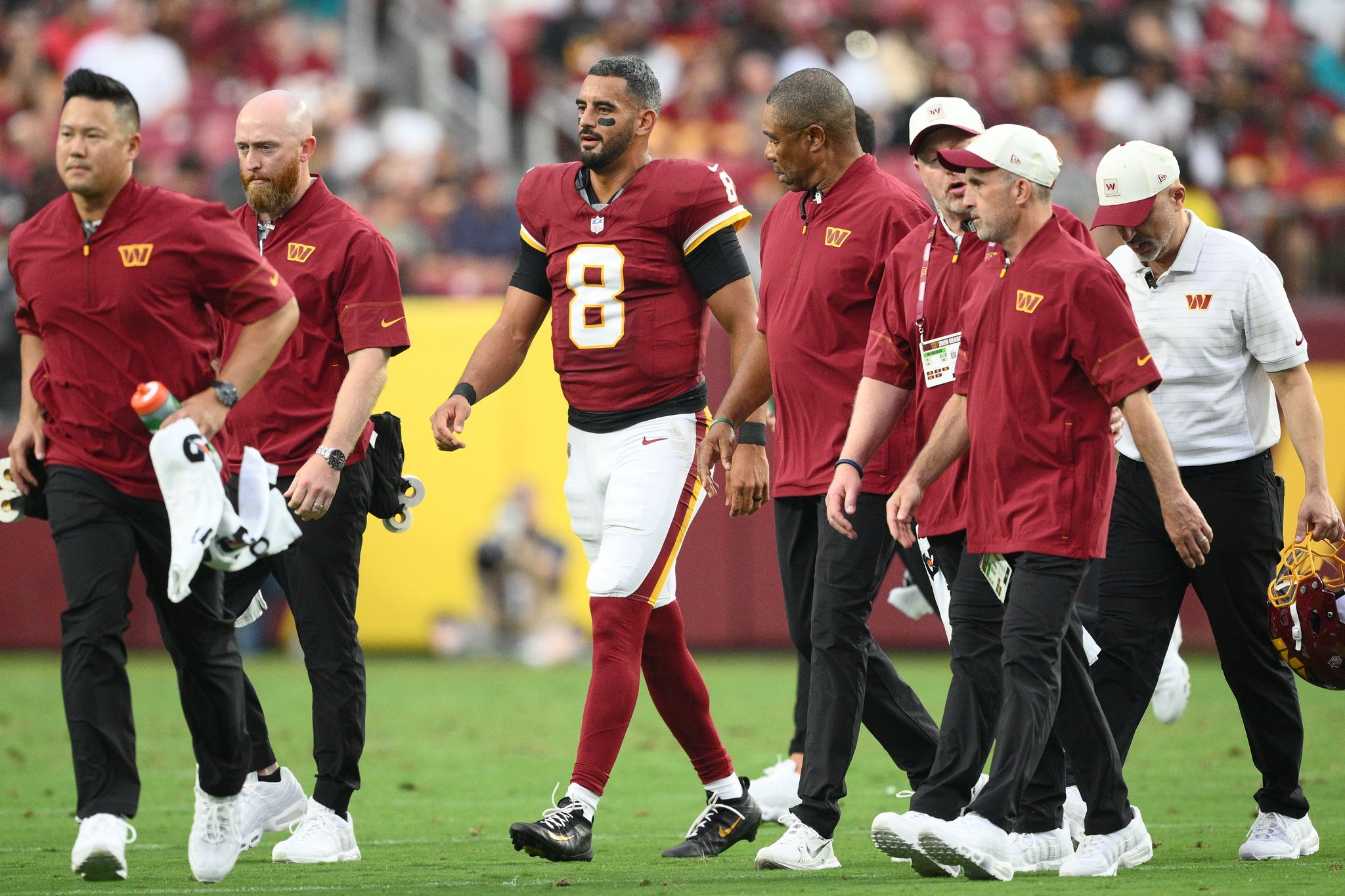 Commanders QB Marcus Mariota has a sprained MCL in his right knee, AP source says By ETHAN CADEAUX , Associated Press