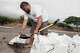 Casey Delaries fills a sandbag in preparation for Hurricane Lala in Kailua-Kona, Hawaii, on Friday.