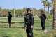 Iraqi security officers stand guard at the site near Baghdad International Airport where Iranian military commander Qassem Soleimani was killed in a U.S. drone strike, during a visit by Iranian Parliament Speaker Mohammad Baqer Qalibaf in Baghdad, Iraq, Wednesday, Aug. 19, 2026.