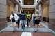 Emily Martin Howle (right) leads a group of land owners opposing a proposed 765kv transmission line route to state Rep. Shelby Slawson’s office in the state Capitol on Aug. 19, 2026.
