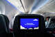 A screen on the back of a seat on a JetBlue Airways plane, at Logan International Airport in September 2025.